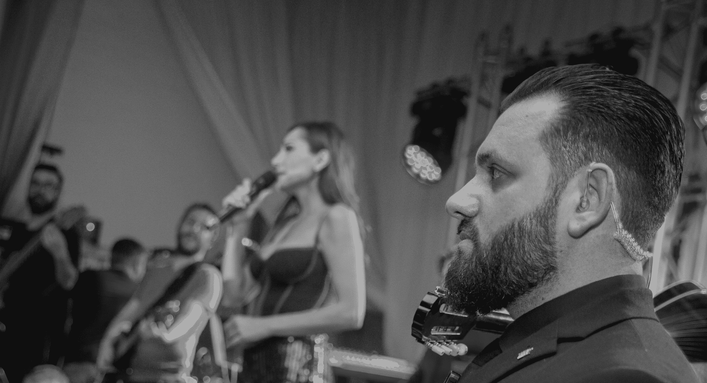 Security guard in a black suit providing security services in London for a celebrity singer