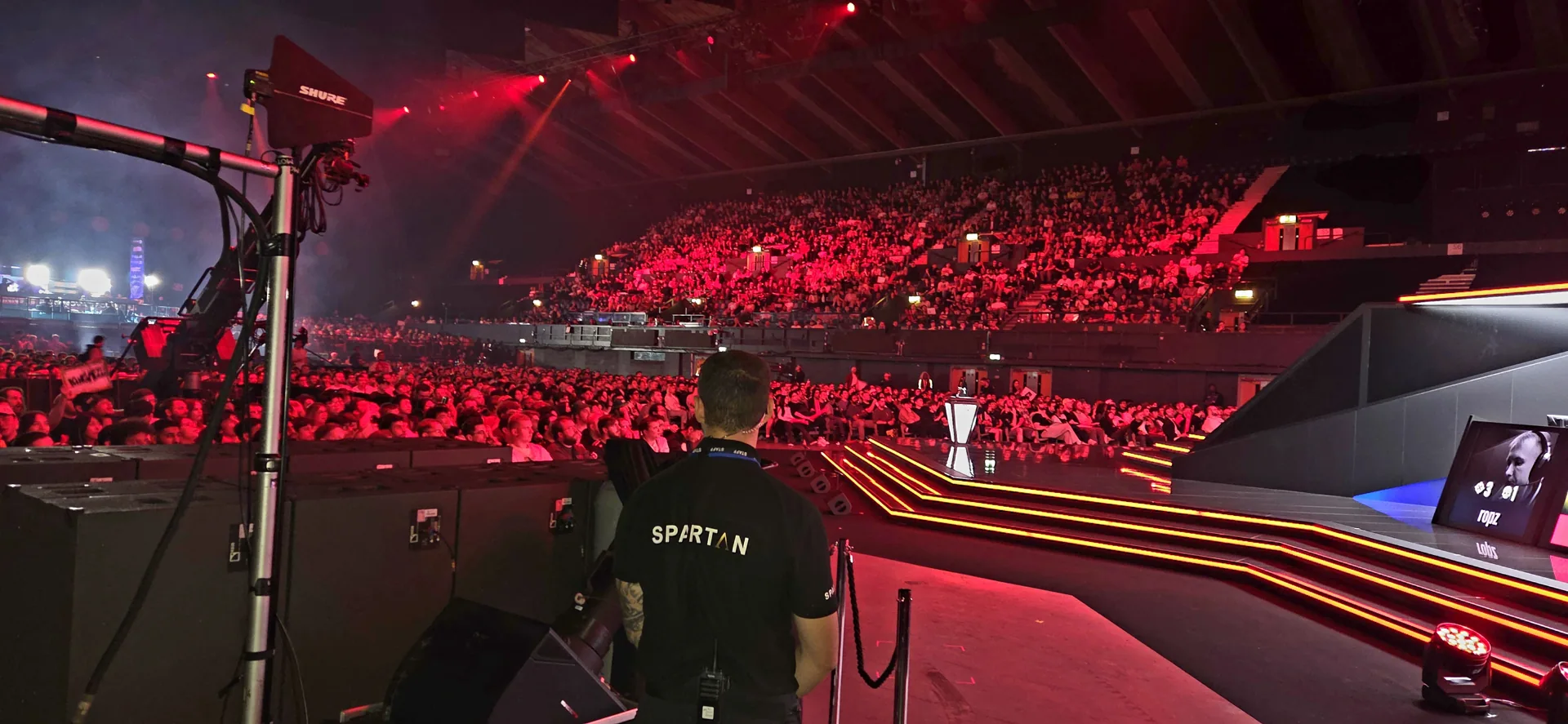 Spartan security officer overseeing a live event in an arena